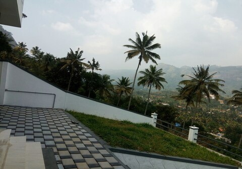 Hotel O Home Homeplus Summer Club bhk Peaceful Nature Munnar