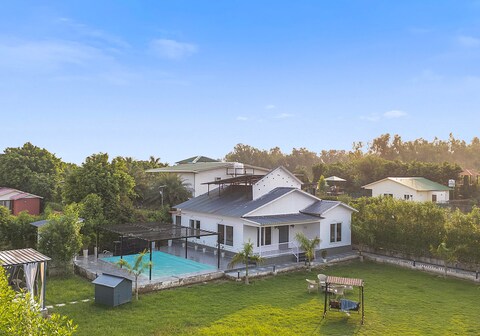 Alaya Stays Nathaniel | 3 BHK Pet friendly Farmhouse with Pool & Garden