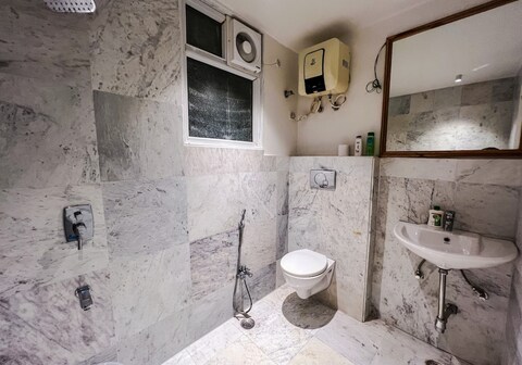 One Uptown 103 (modern 1 BHK loft)