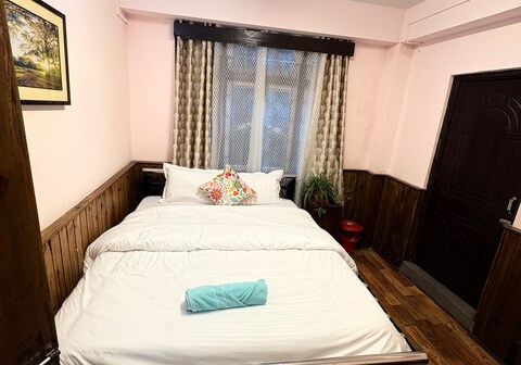 Cozy wooden room with attached washroom