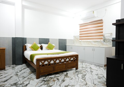 ENKE SUITES | 10 min to infopark kakkanad