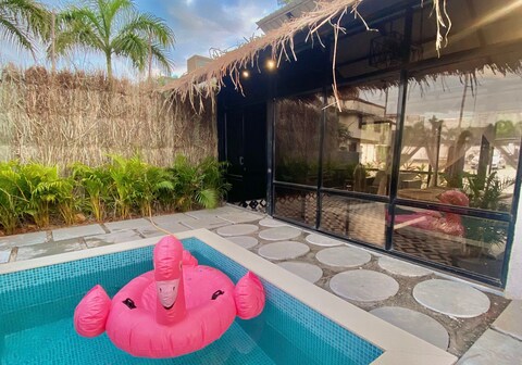 Glass house with pool in Lonavala by Miracle resort