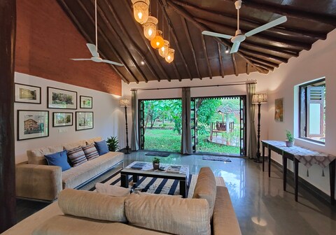 SaffronStays Mango Huts by the river