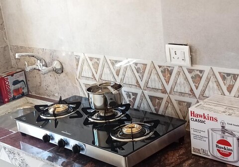 Hill Town Apartment Caretaker and Kitchen