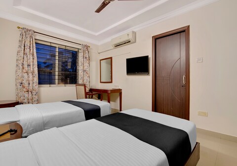 Capital O Elegant Amethyst Business Hotel Near Ragigudda Sri Prasanna Anjaneyaswamy Temple