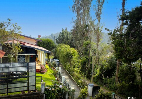 Leela's country house behind rose garden