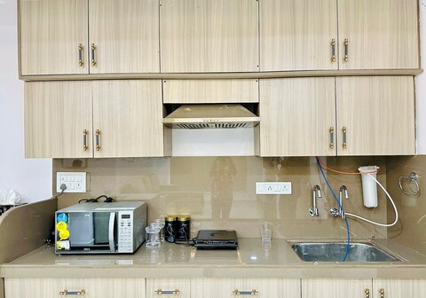 Cozy 2BHK with Balcony and Kitchen Orange Orchid