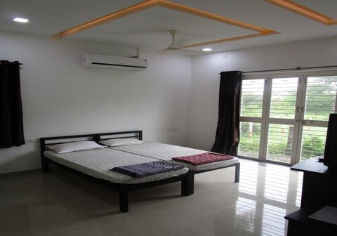 Karkare Holiday Home | Rooms & Restaurant