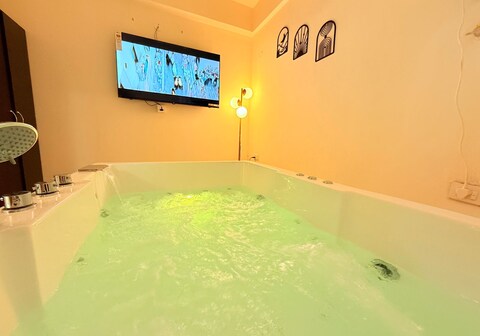 Luxury 1 BHK Private Jacuzzi Big Screen Fun