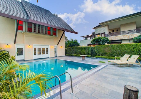 StayVista at Ekant Villa w/ Bonfire & Outdoor Pool