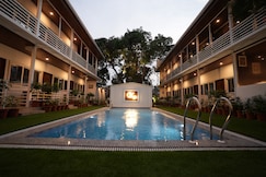 White Flower Pool Facing Cottages, Goa