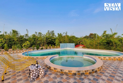 StayVista at Green Embrace - Swimming Pool, Rainshower, Terrace & Lawn