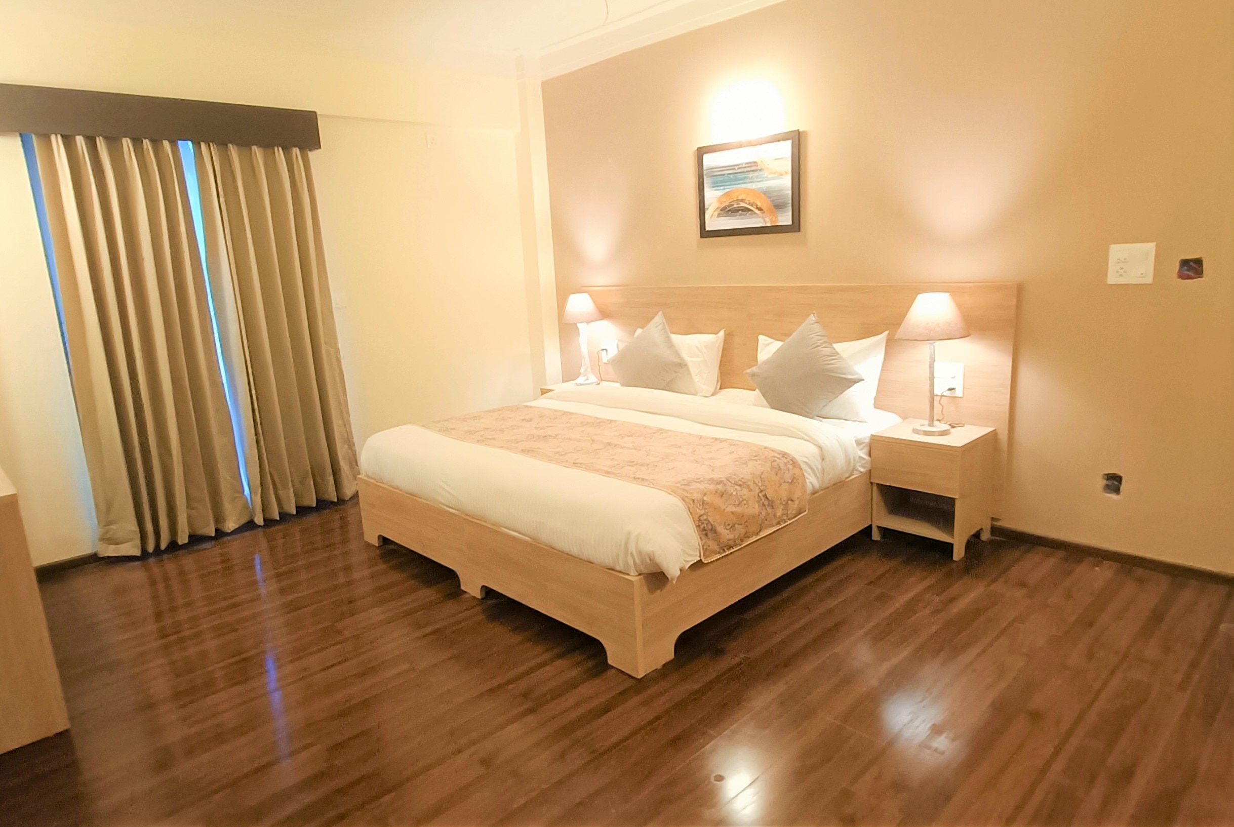 Deluxe One Bedroom Suite with Kitchenette Living Area and Balcony 1