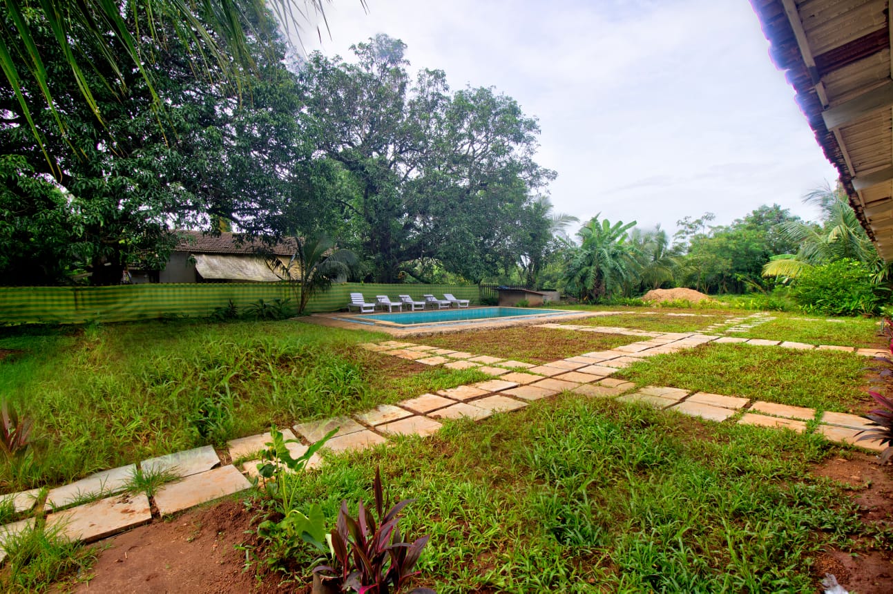 6 BHK Yellow Villa - Tap to explore photos