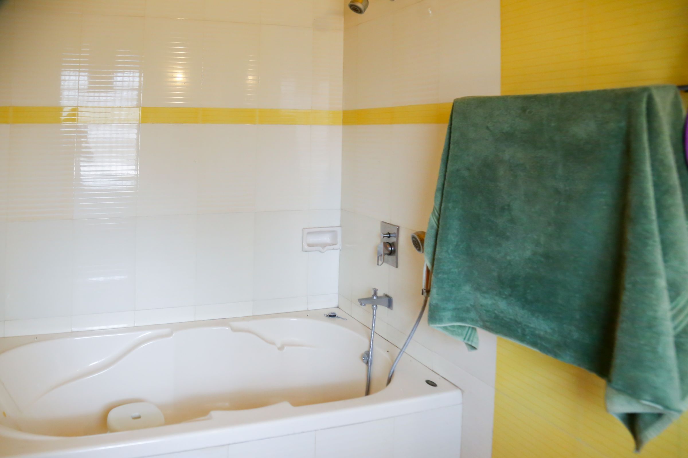 AC Room with Bathtub - Tap to explore photos