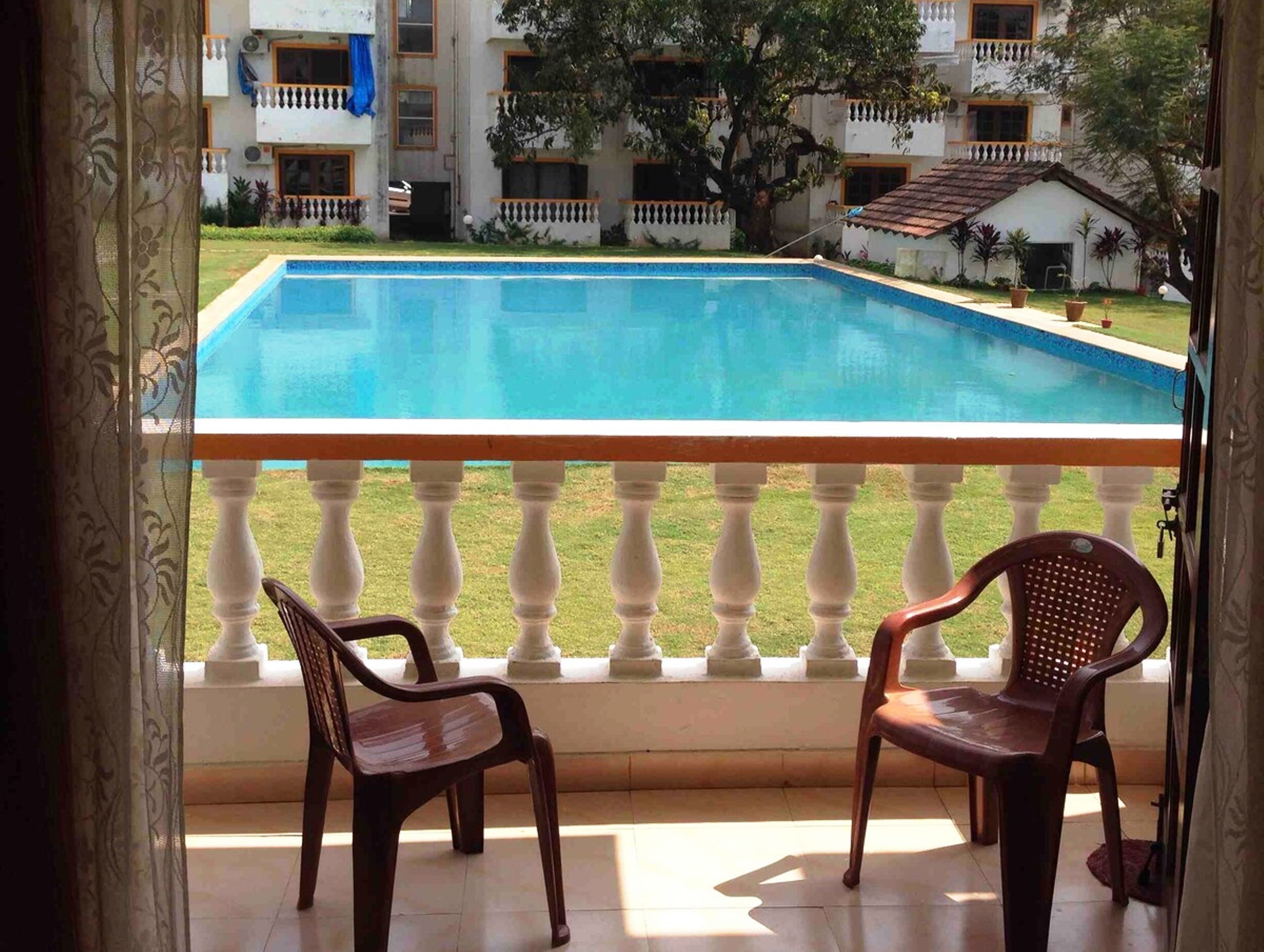 Relaxing pool facing home in Candolim - Tap to explore photos