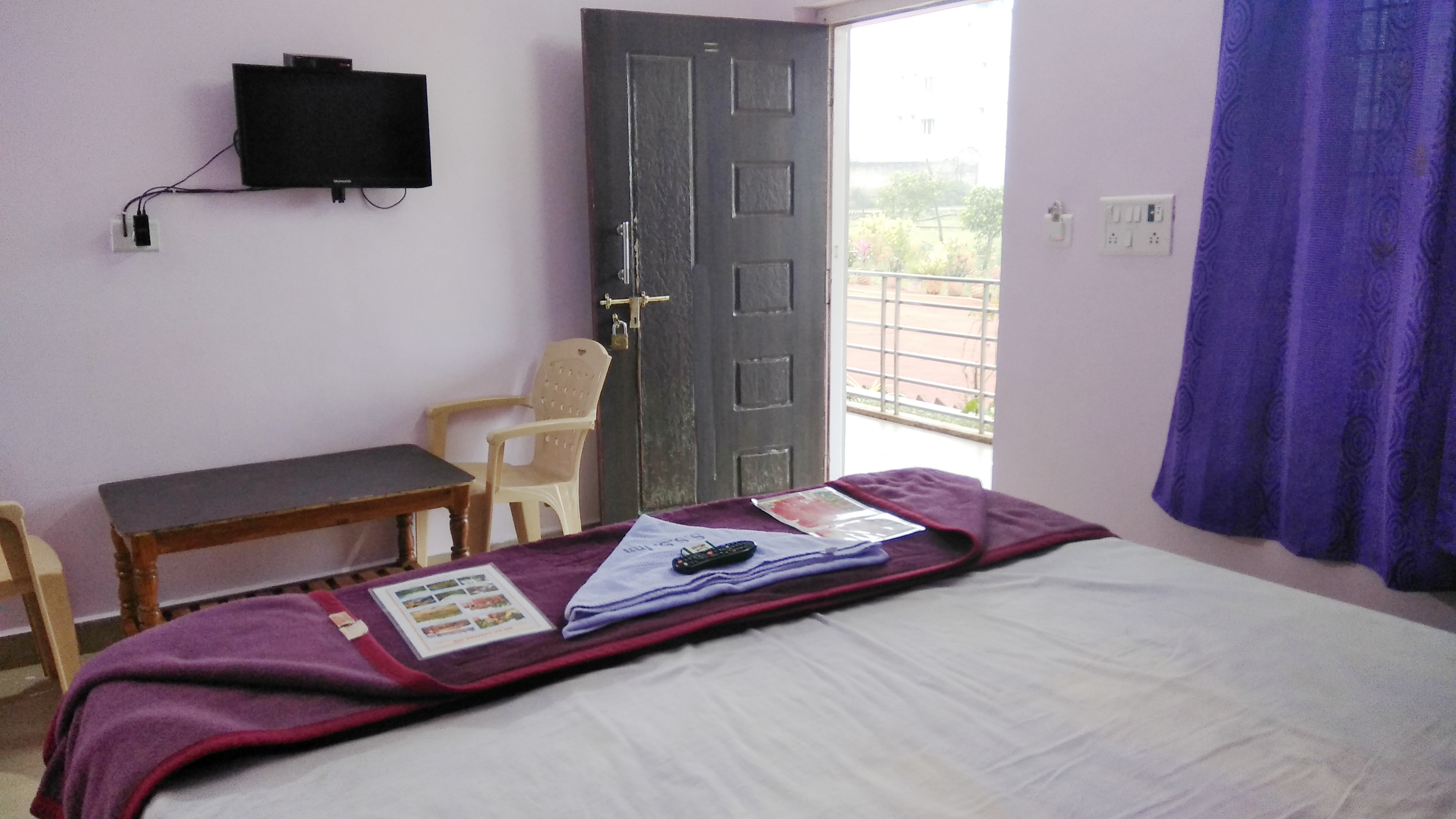 SRI SAI SUVARNA INN - Tap to explore photos