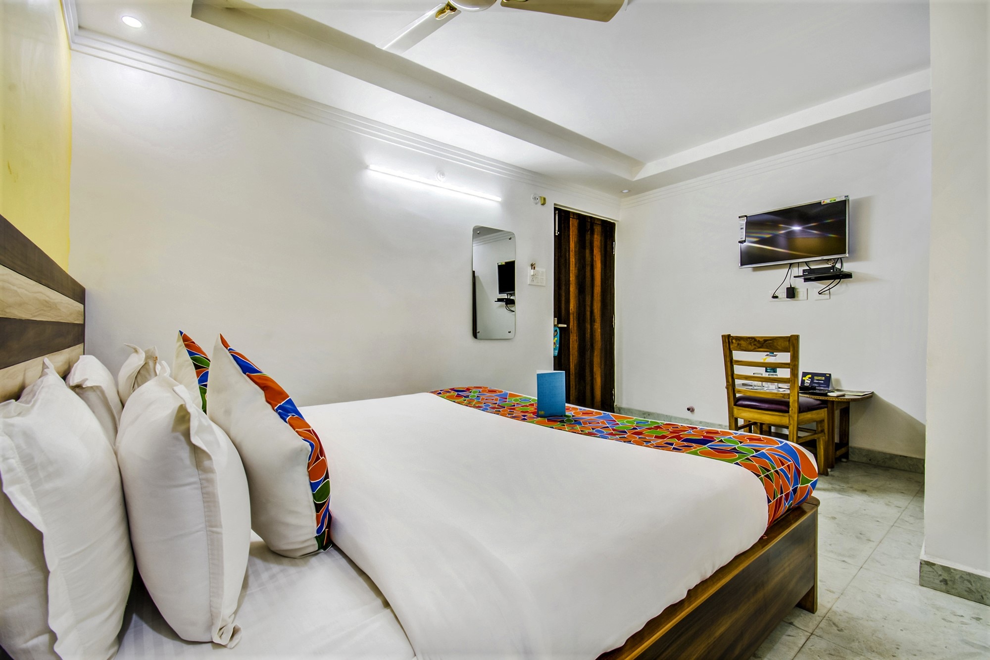 FabHotel Grand Sheela - Tap to explore photos