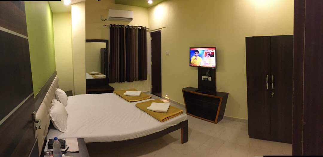 Hotel Om Executive  - Tap to explore photos