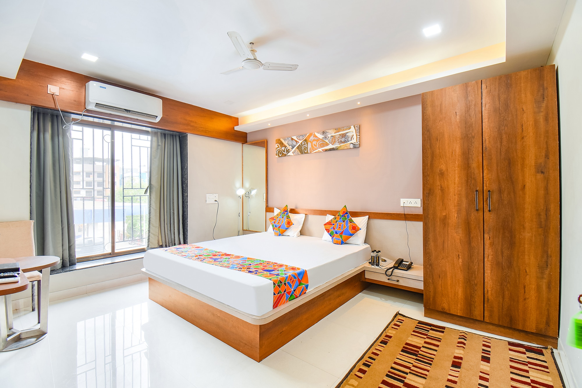 FabHotel Prime Rajmudra - Nr. Butterfly Trampoline Park - Hinjawadi - Tap to explore photos