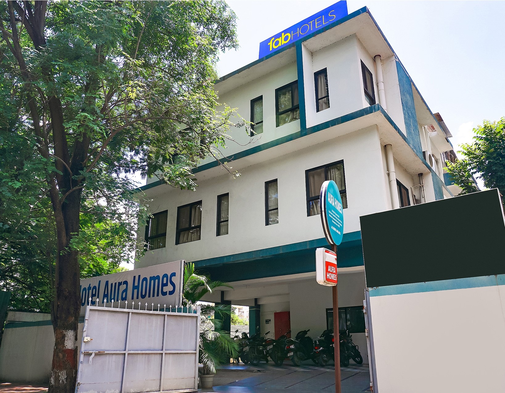 FabHotel Aura Homes - Nr. Khandoba Mandir - Tap to explore photos