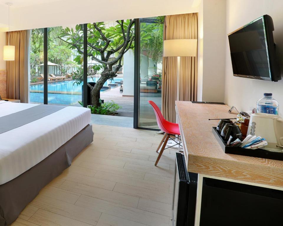Hotel NEO Plus Kuta - Legian by ASTON - Tap to explore photos