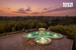 StayVista at Green Embrace - Swimming Pool, Rainshower, Terrace & Lawn, Hingana
