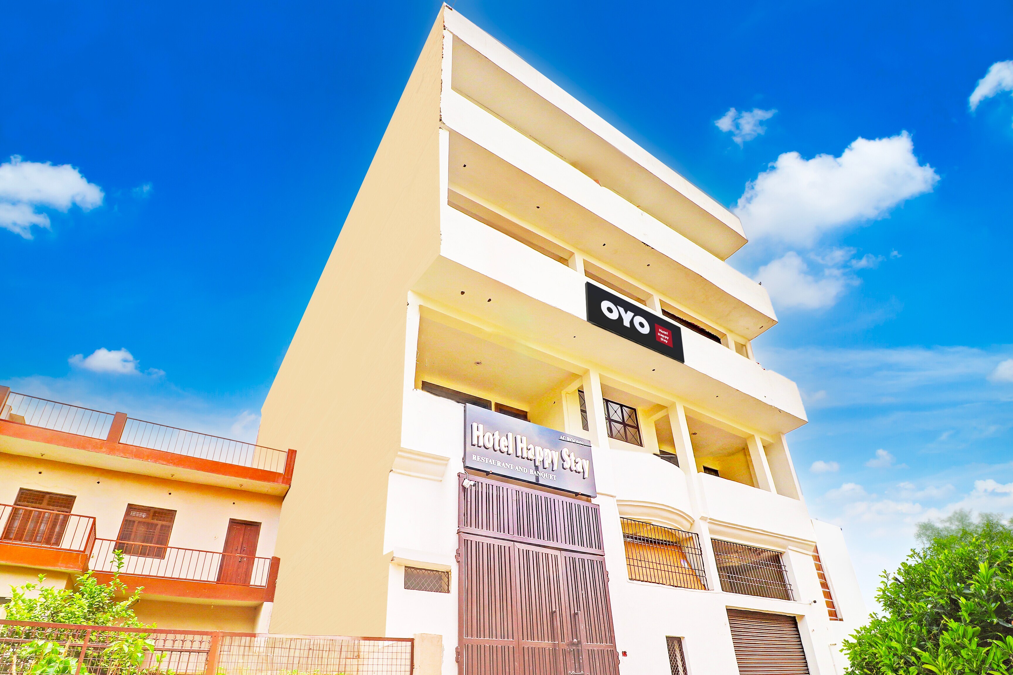 Hotel O Happy Stay - Tap to explore photos