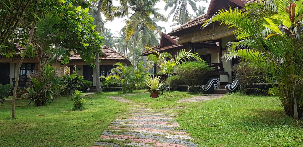 Maadathil Cottages - Tap to explore photos