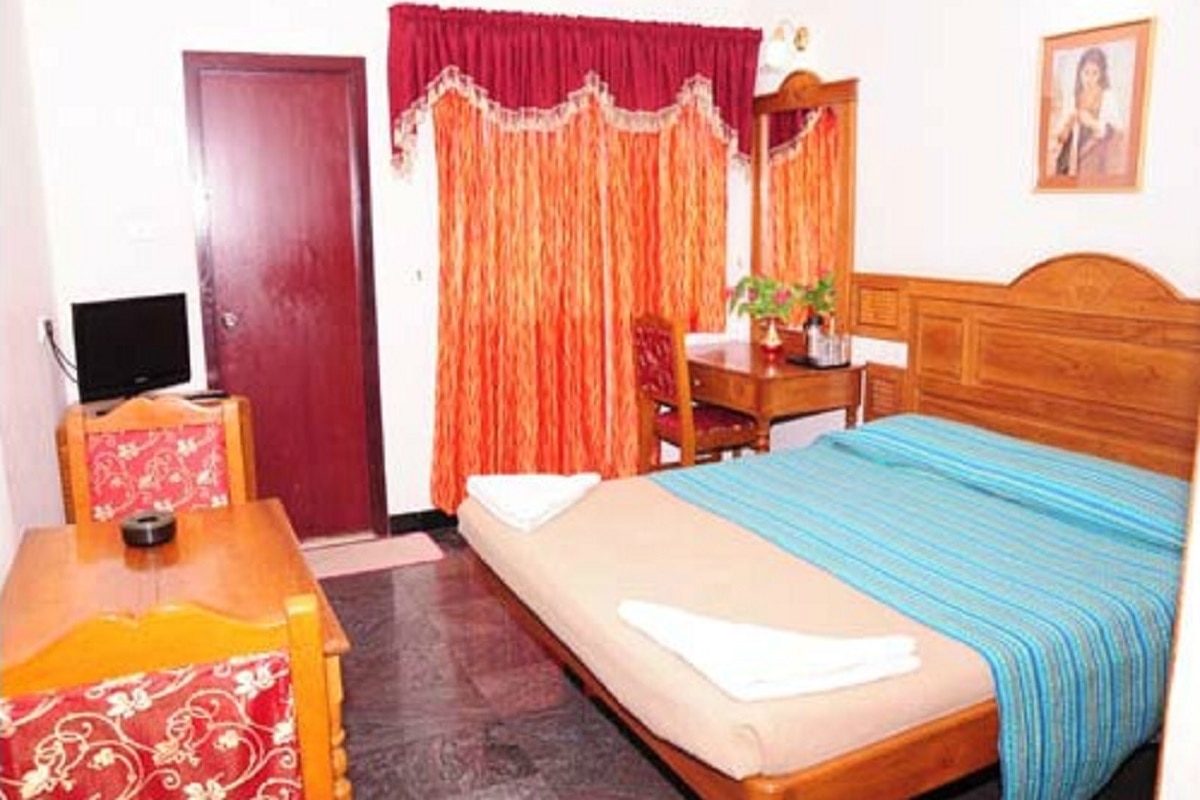 Hotel Theni International - Tap to explore photos