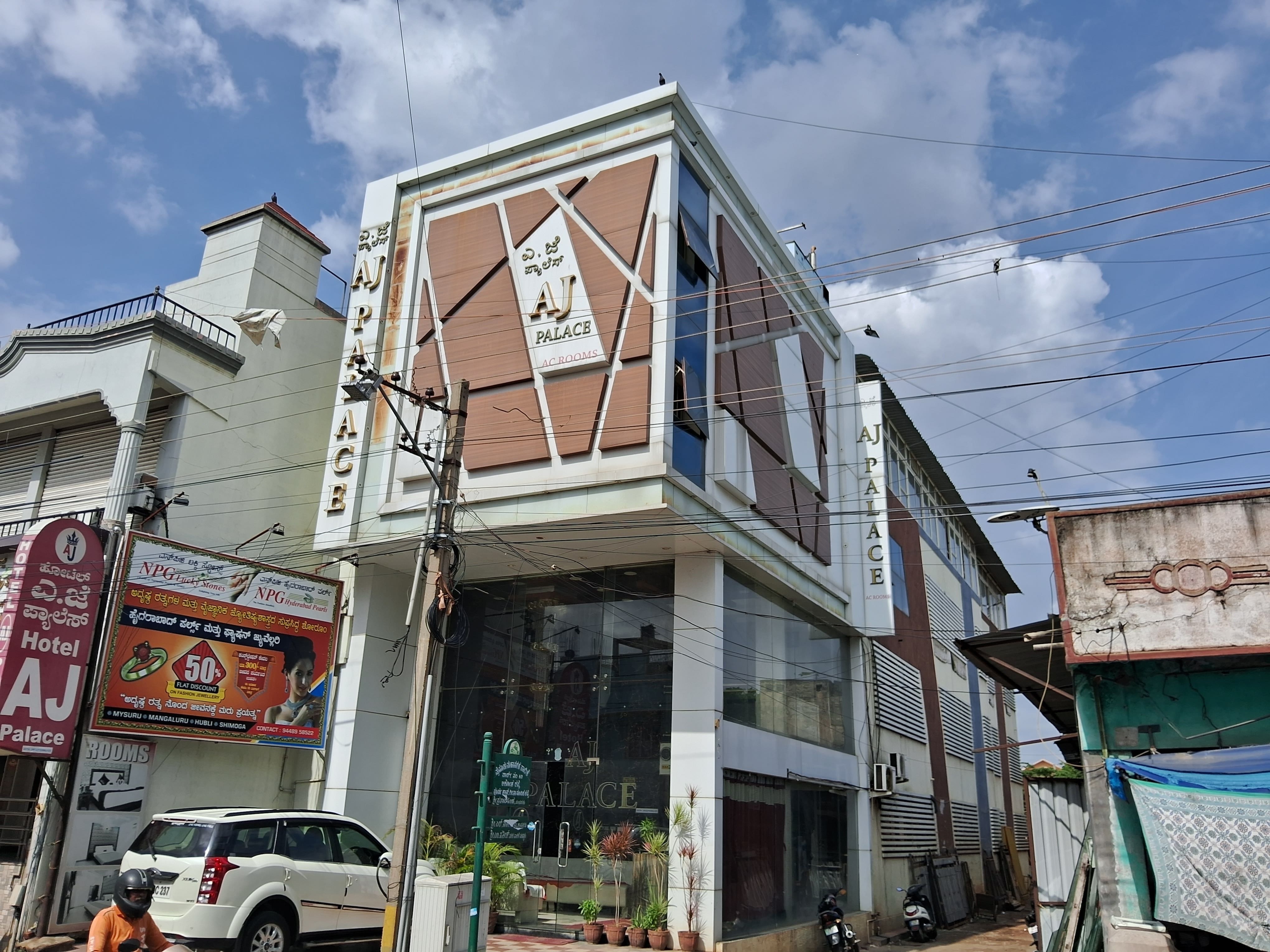 OYO Flagship 8281 Aj Palace - Tap to explore photos
