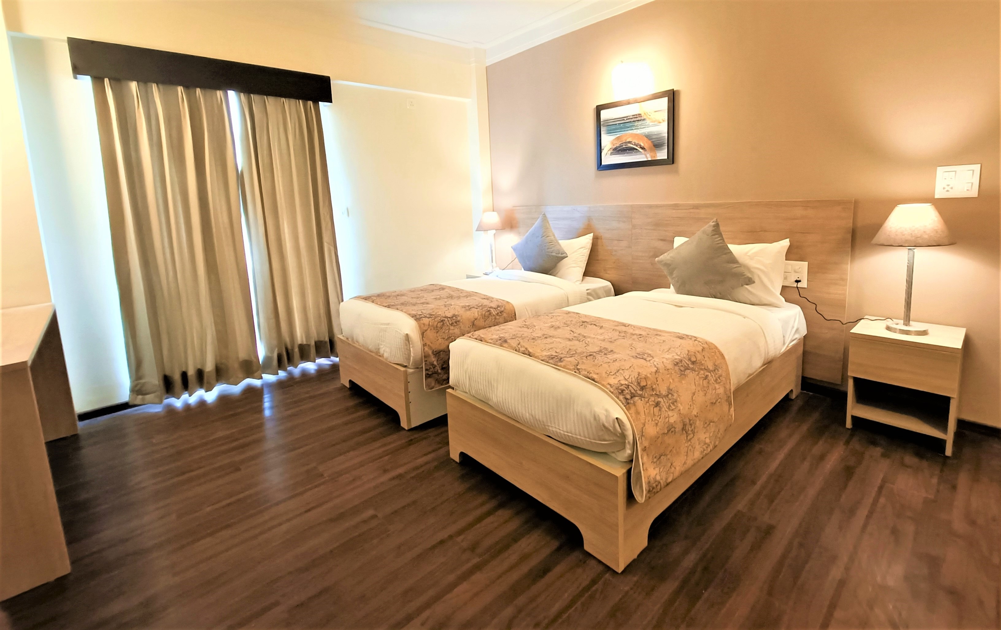 Deluxe Two Bedroom Suite with Kitchenette Living Area and Balcony 1