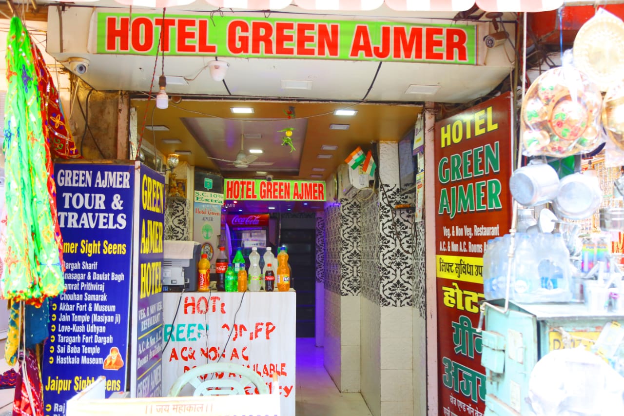 Green Hotel - Tap to explore photos