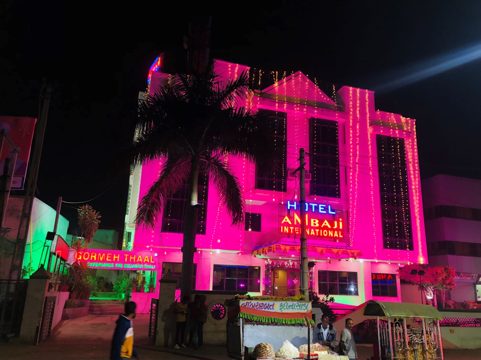 Hotel Ambaji International - Tap to explore photos