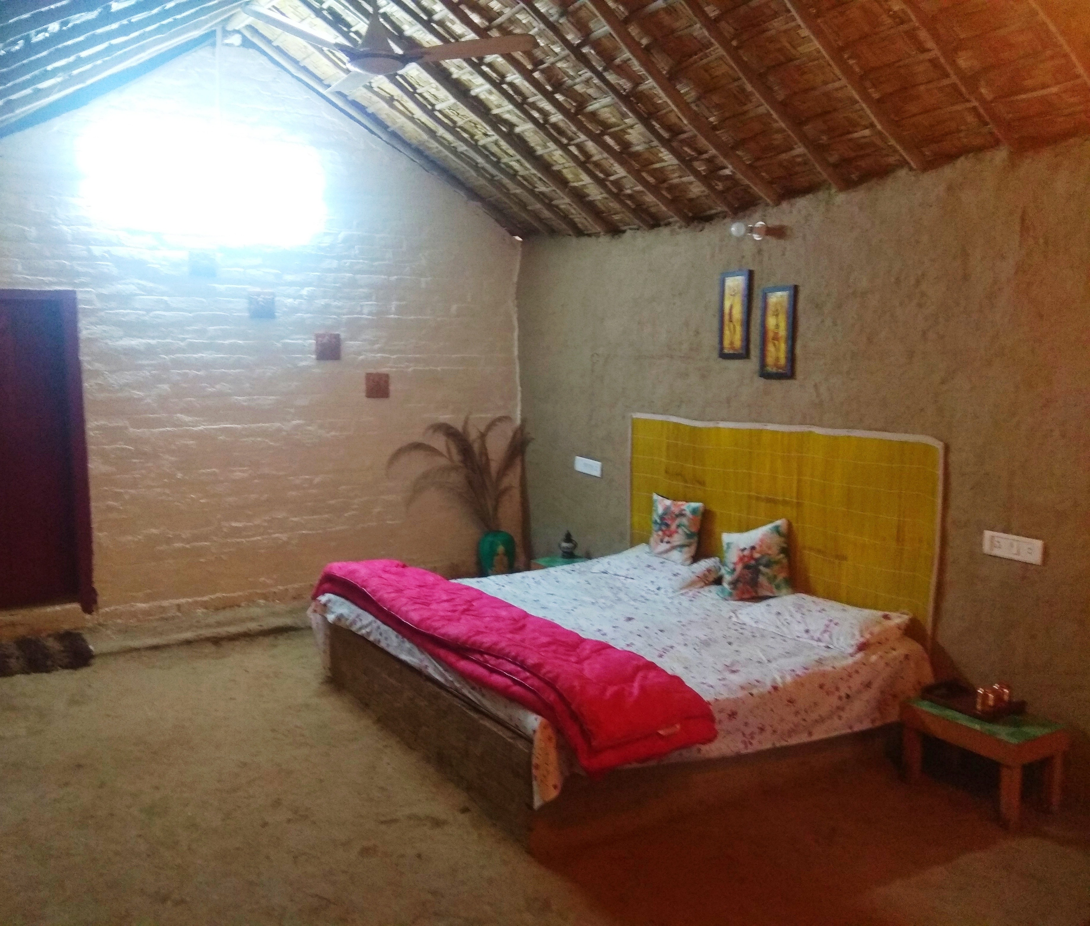Mudhouse Under Mangoes Homestay - Tap to explore photos