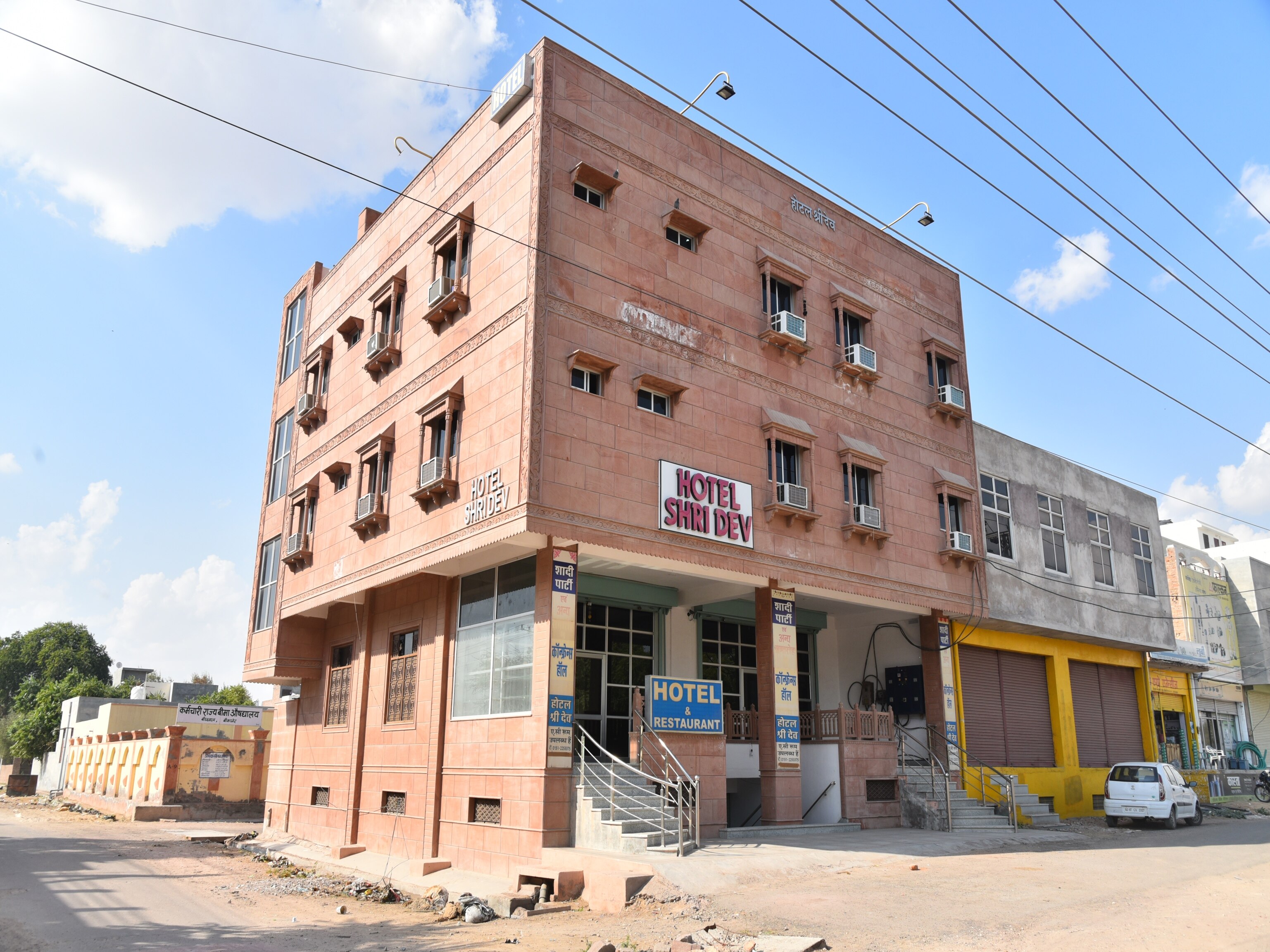 Hotel Shri Dev - Tap to explore photos