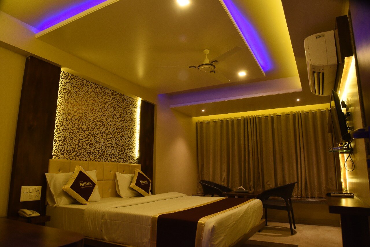 Hotel Nisha - Tap to explore photos