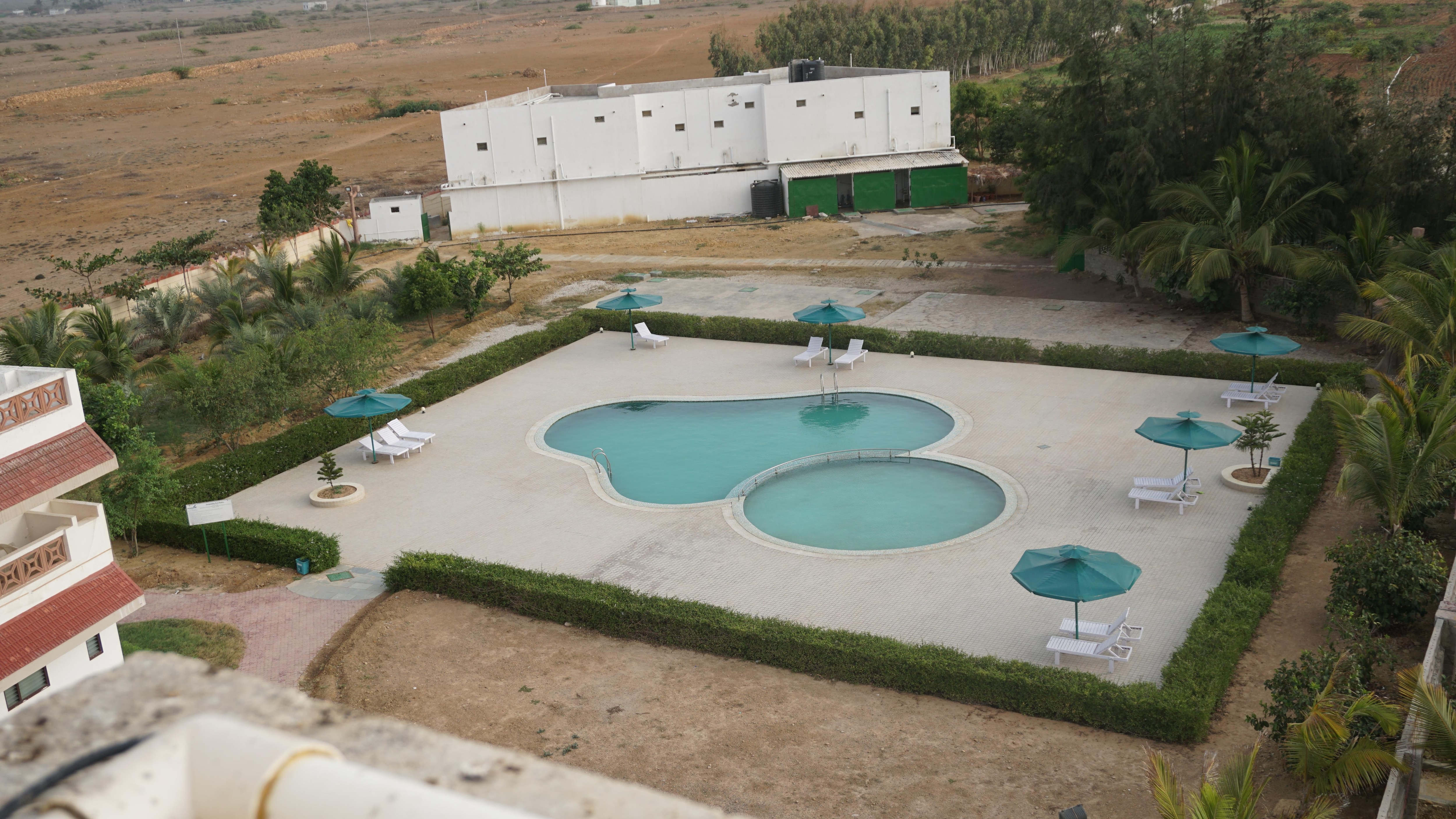 'Goverdhan Villa powered by Goverdhan Greens - Tap to explore photos