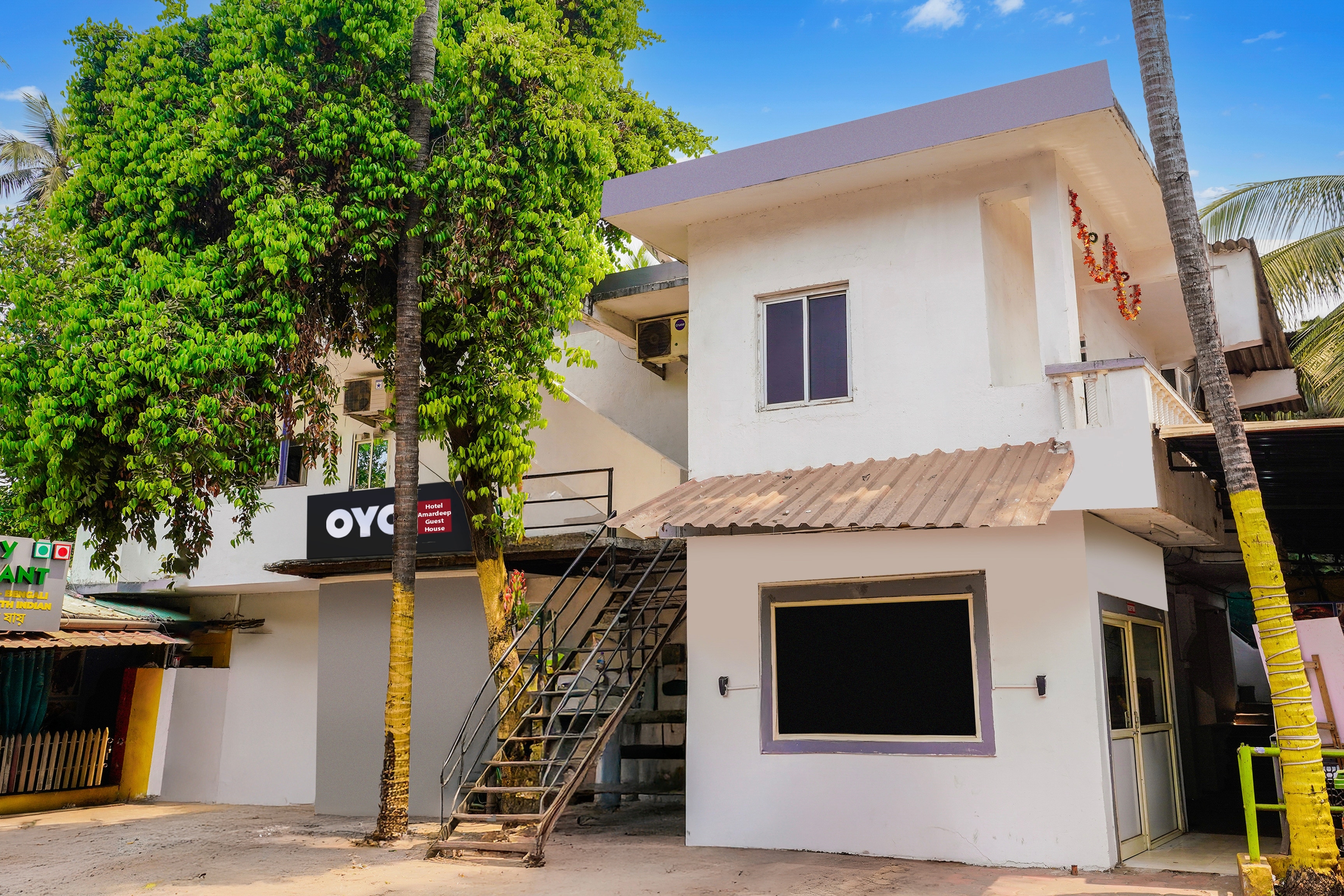 Hotel O KPN Holiday Homes - Tap to explore photos