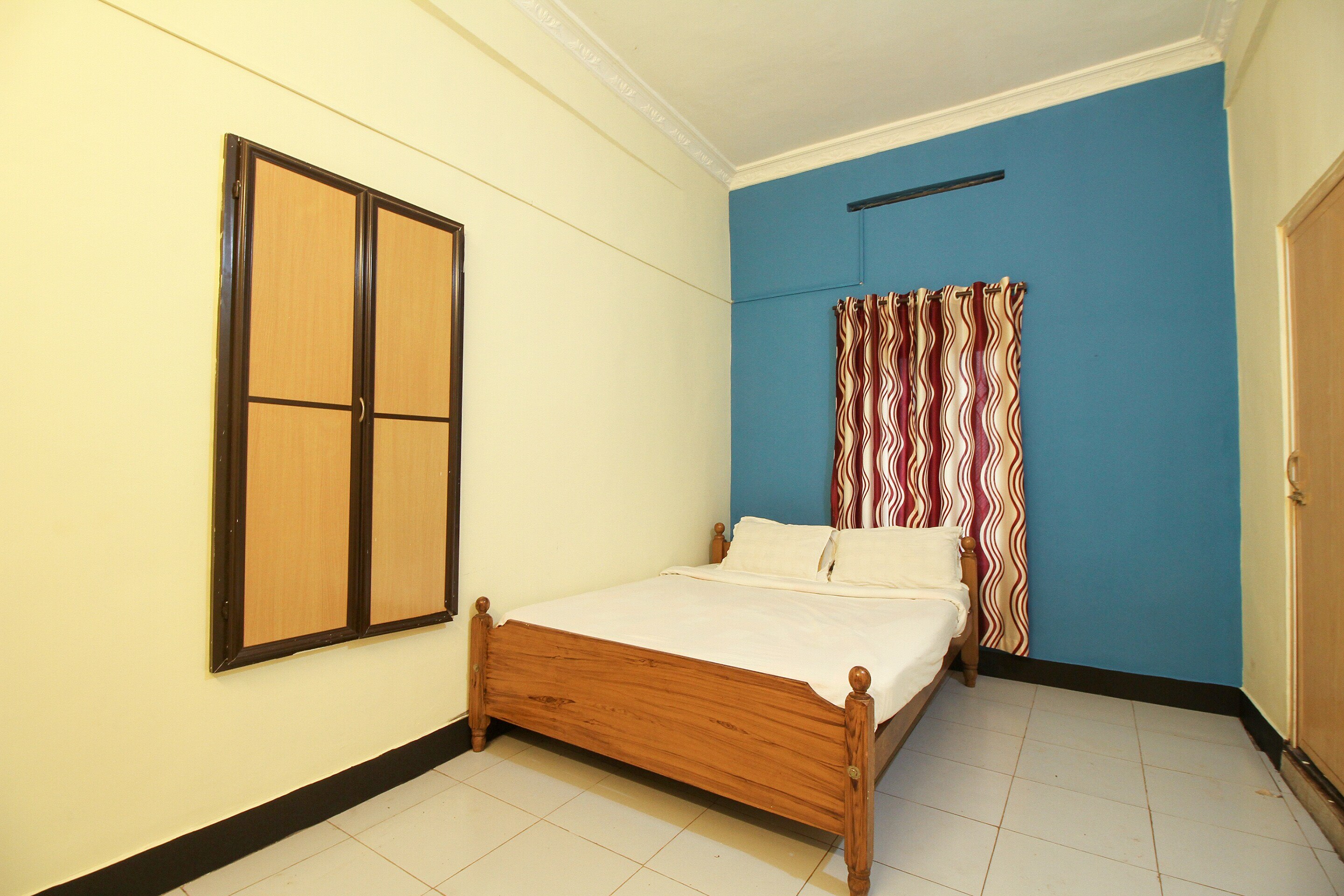 SPOT ON Mukkam Tourist Home - Tap to explore photos