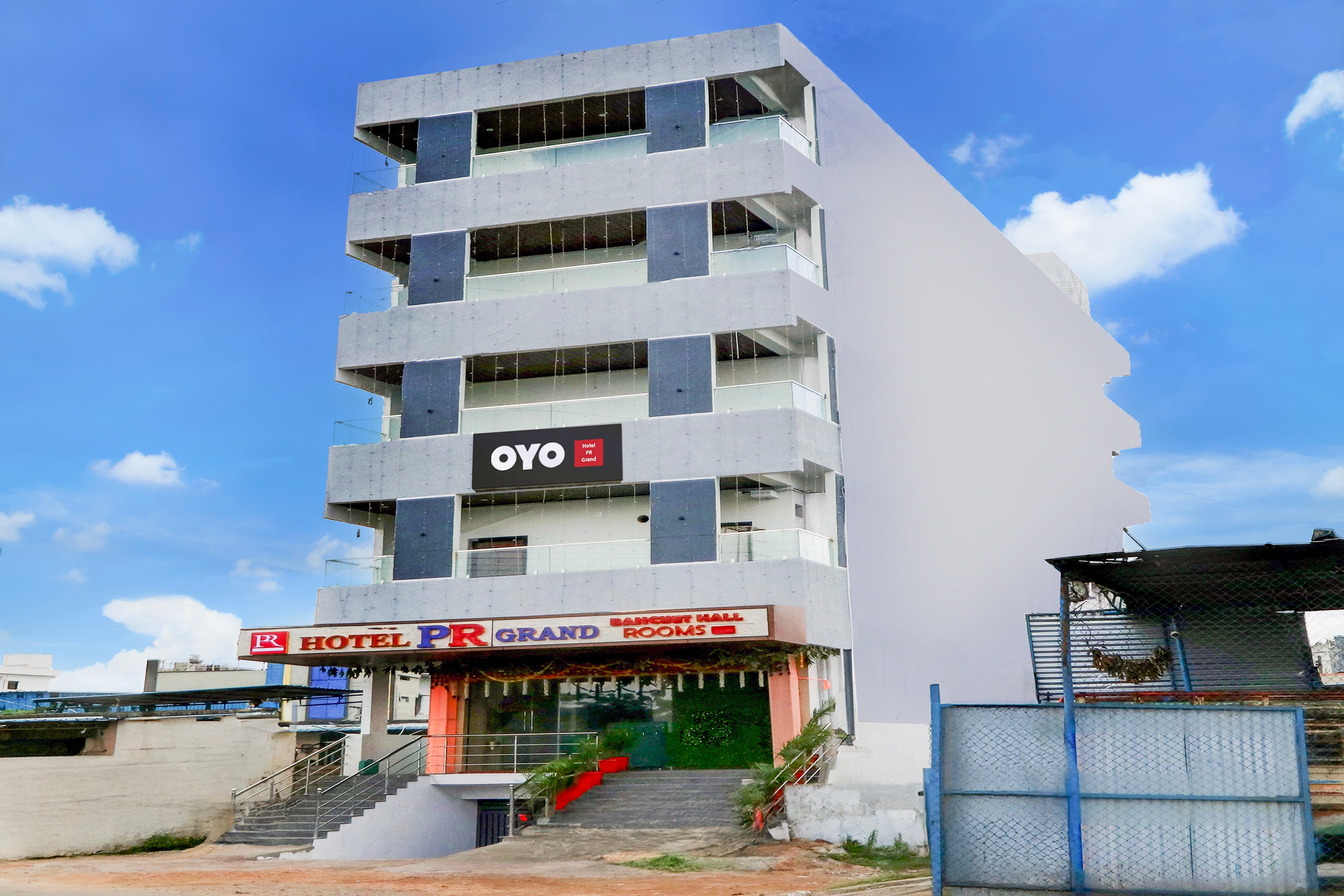 Hotel O PR GRAND - Tap to explore photos
