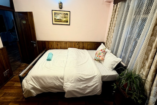 Cozy wooden room with attached washroom