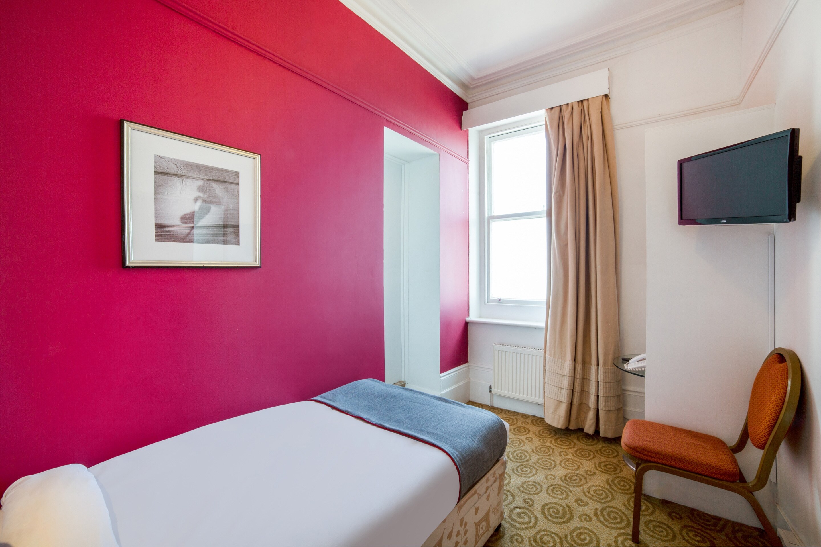 OYO The Strand Hotel - Tap to explore photos