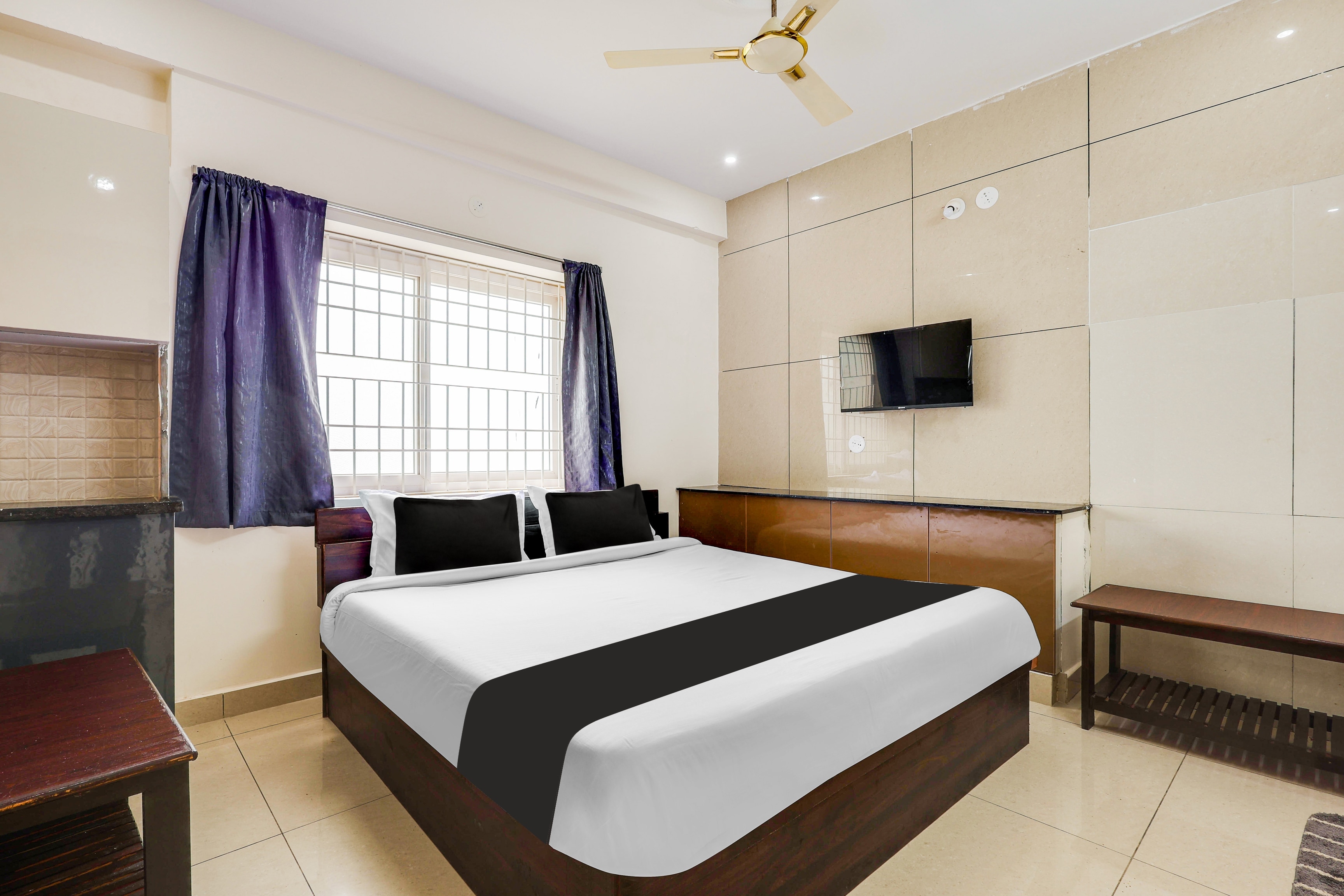 Hotel O Relax Guest Rooms - Tap to explore photos