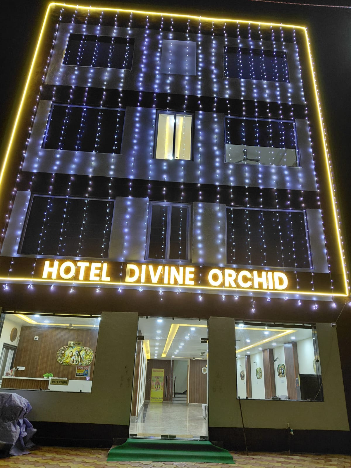 Hotel Divine Orchid - Tap to explore photos