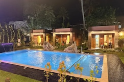 Aruvi on the cliff | Cottages and Pool, Varkala
