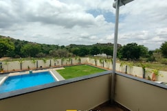 Serene Stay 4BHK FarmVilla | Pool | Lawn | BBQ | Events By AweNest, Miryalaguda