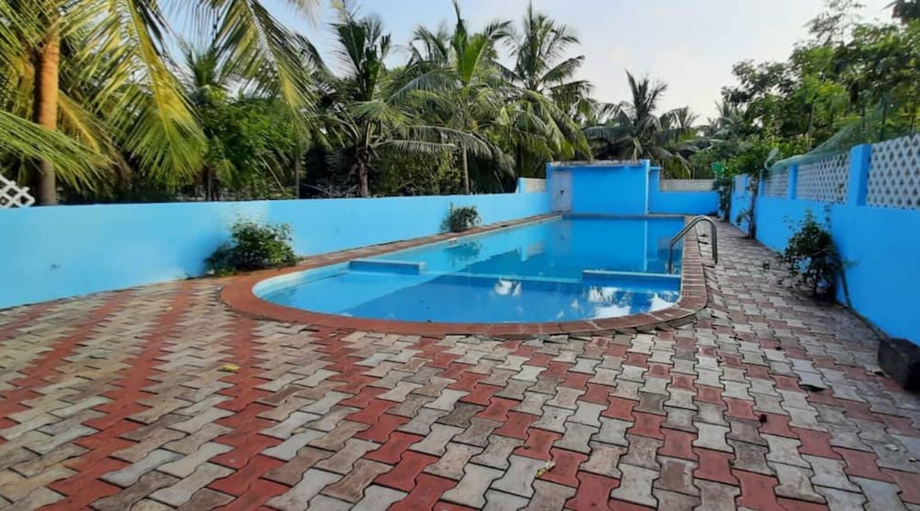 Marvel Times individual house with pool and lawn. - Tap to explore photos