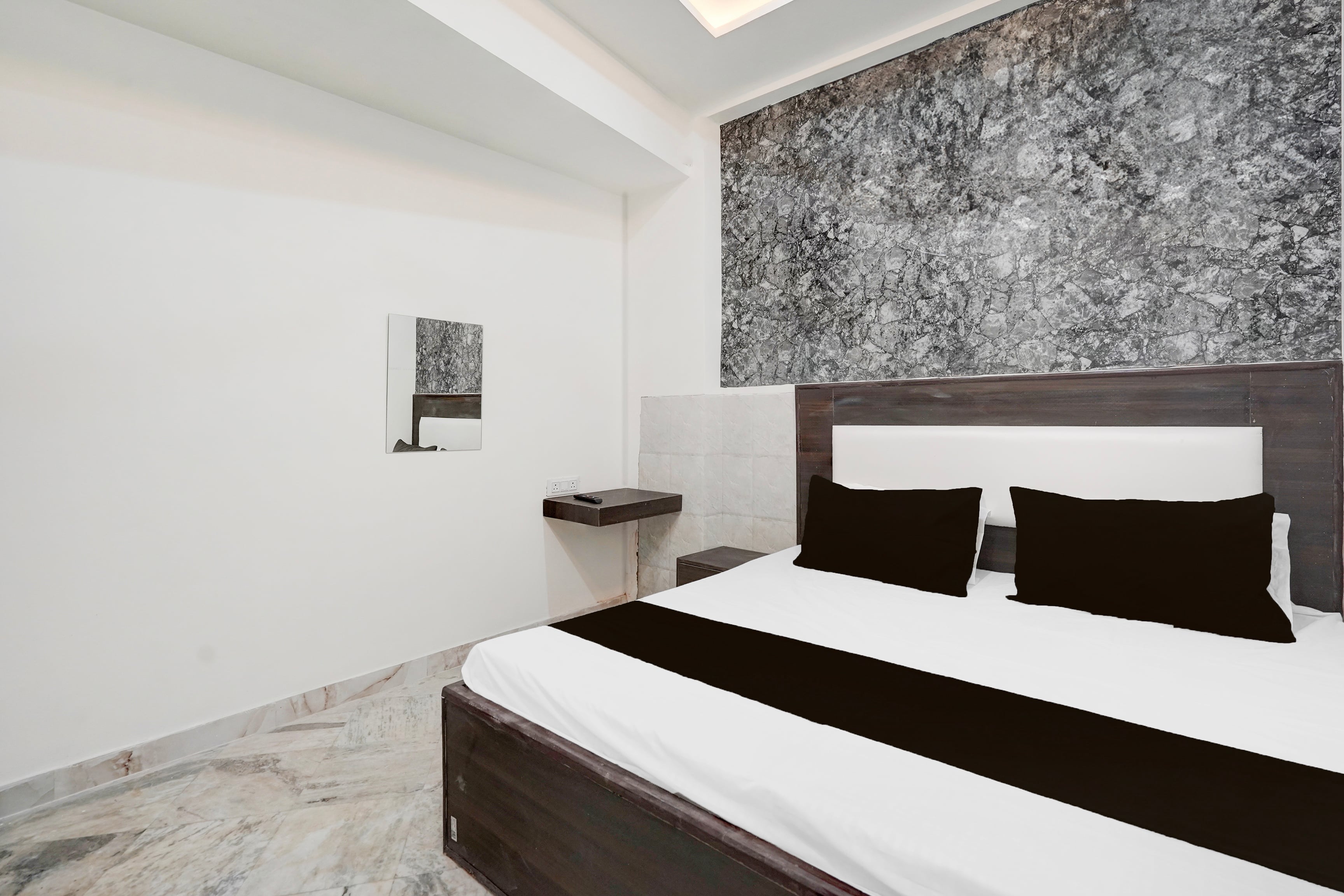 Hotel O AB Rooms - Tap to explore photos