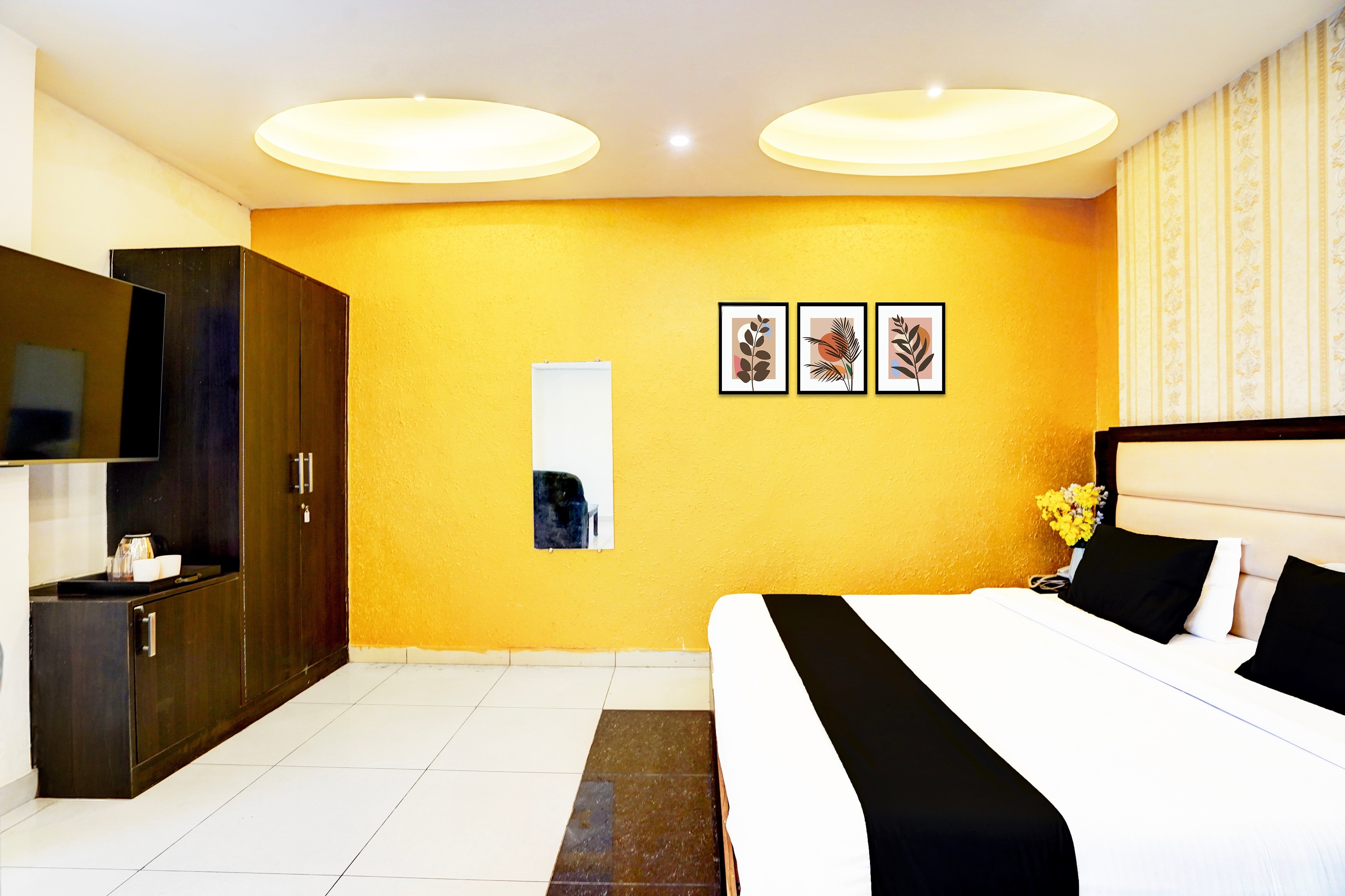 Collection O Surya Enclave Formerly Aroma Regency - Tap to explore photos